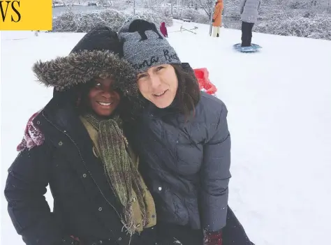  ?? HO-KARINA REID / THE CANADIAN PRESS ?? Atosha Ngage, left, and Karina Reid went on a trip to see snow after Reid sponsored Ngage, a refugee from the Democratic Republic of Congo,
through the Blended Visa Office Referred Refugees program, one of Canada's three resettleme­nt streams to sponsor refugees.