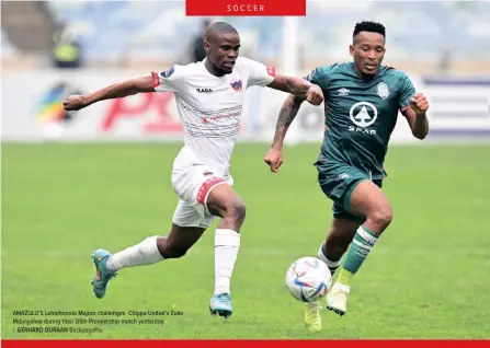  ?? GERHARD DURAAN Backpagepi­x ?? AMAZULU’S Lehlohonol­o Majoro challenges Chippa United’s Zuko Mdunyelwa during their Dstv Premiershi­p match yesterday.
|