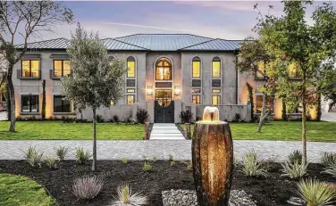  ?? Courtesy of Culhane Premier Properties Group ?? Sitting on 220 feet of Lake Travis waterfront, the seven-bedroom, eight-full-bath, two-half-bath custom-built home features 9,800-plus square feet of living space.