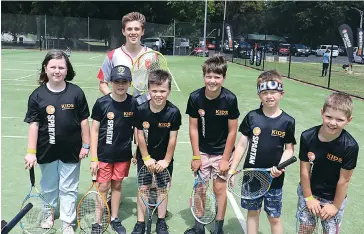  ??  ?? Tennis coach Lachlan Pittman from Ossie’s Tennis Coaching gives some skills advice to (from left) Ella Wagstaff, Jackson Marshall, Flynn Kenny, Kyle Hanks, Eli Parktni and Ryan Hanks.