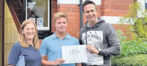  ??  ?? ●● Young golfer Josh Turnock with Angela Jackson and Michael Vaughan