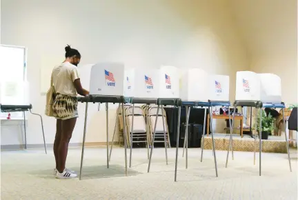  ?? STAFF FILE ?? Briana Thornton votes in Virginia Beach in 2021, as Virginia holds several primaries for state and local offices.