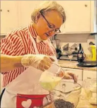  ?? SUBMITTED PHOTO ?? Penny Steele of Indian Brook is seen here making chocolates using one of her recipes in her kitchen in this handout photo. She relaunched her Cabotto Chocolate shop earlier this month alongside her sister, Deb Karn.