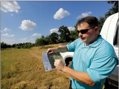  ?? AP/ERIC GAY ?? Heath Frantzen uses a map to point out where the proposed natural gas pipeline would cross his 260-acre ranch in central Texas.