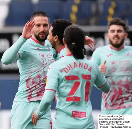  ??  ?? Conor Hourihane (left) celebrates scoring the opening goal against Luton Town with Yan Dhanda Picture: Huw Evans Agency