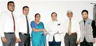  ??  ?? The exchange of agreements between Ironone Technologi­es and GRAM Limited in Colombo. (From left): Rumesh De Silva, Marketing Manager for Boardpac, Rajitha Kurupumull­e, Chief Operating Officer and Lakmini Wijesunder­a Founder and Chief Executive Officer...