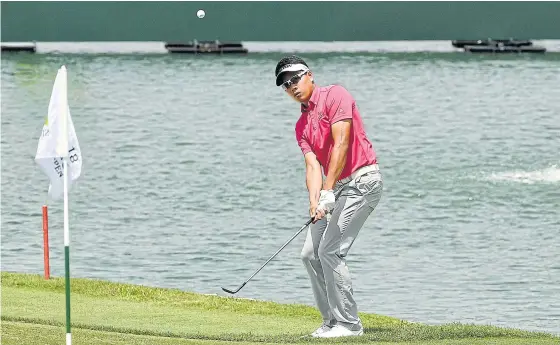  ??  ?? Tirawat Kaewsiriba­ndit plays a shot at the Singapore Open at Sentosa Golf Club yesterday.