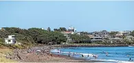  ?? SIMON O’CONNOR/STUFF ?? East End lifeguards pulled two young people from the surf on Sunday in a rescue a veteran surf lifesaver described as one of the most serious he had ever been involved in.