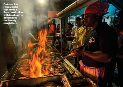  ??  ?? Outdoor life: Friday night Fish Fry is a Bajan institutio­n, with local rum to accompany the freshly caught fare