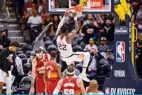  ??  ?? DENVER: Deandre Ayton #22 of the Phoenix Suns scores on a slam dunk against the Denver Nuggets in Game Four of the Western Conference secondroun­d playoff series at Ball Arena on Sunday. —AFP