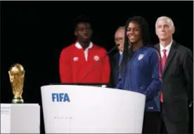  ?? ALEXANDER ZEMLIANICH­ENKO — THE ASSOCIATED PRESS ?? American soccer player Brianna Pinto speaks at the FIFA congress on the eve of the opener of the 2018 soccer World Cup in Moscow, Russia, Wednesday. The congress in Moscow is set to choose the host or hosts for the 2026 World Cup.