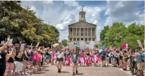  ?? JOHN PARTIPILO ?? A rally in support of abortion rights draws hundreds to downtown Nashville on May 14.