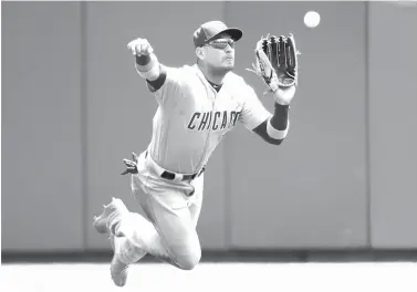  ?? John Minchillo/Associated Press ?? ■ Chicago Cubs center fielder Albert Almora Jr. catches a fly-out by Cincinnati Reds’ Joey Votto in the fourth inning of a baseball game Sunday in Cincinnati.