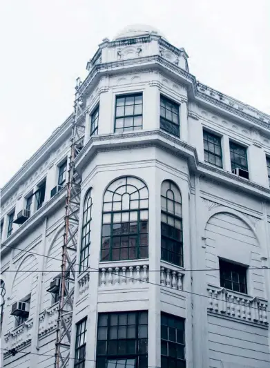  ??  ?? Opposite page: The staircase inside the First United Building, where The HUB and the 98B COLLABorat­ory are located.
Top: The Regina Building, a four-storey building designed by Andres Luna de San Pedro, son of Juan Luna.