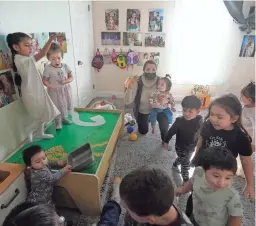  ?? JEFF CHIU/AP ?? Patricia Moran, center, watches as children play at her child care facility in San Jose, Calif. Many times Moran has thought about closing her day care.