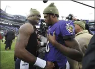  ?? GAIL BURTON - THE ASSOCIATED PRESS ?? Houston Texans quarterbac­k Deshaun Watson, left, talks with Baltimore Ravens quarterbac­k Lamar Jackson after an NFL football game, Sunday, Nov. 17, 2019, in Baltimore. The Ravens won 41-7.