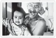  ?? FILM STILL ?? A still from Mahatma Gandhi: 20th Century Prophet. Gandhi is seen with a child aboard the SS Rajputana on his way to London for the Round Table Conference. Journalist and writer A K Chettiar travelled over 100,000 km across India and the world to collect video footage for the documentar­y. This footage was first screened in India, and later produced in Hollywood, USA, in 1953.