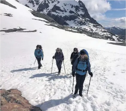  ??  ?? > Caroyn Hitt, front, braved snow and perilous rainforest­s to trek across Patagonia to raise funds for Velindre