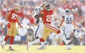  ?? Scott Strazzante / The Chronicle ?? Defensive back Jimmie Ward, who made two key defensive plays in the fourth quarter, celebrates a stop in the 49ers’ win over the Rams on Sunday.
