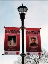  ?? ?? The banners of Steven Senyk and John Burnett are installed in Memorial Park.