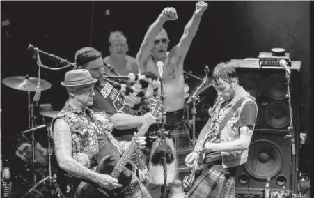  ??  ?? Guitarist Jono McGee, front left, onstage with the Real McKenzies. The band plays Upstairs Cabaret in Victoria tonight.