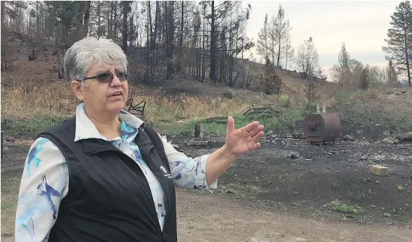  ?? JENNIFER SALTMAN/PNG ?? On Wednesday, Williams Lake Indian Band Chief Ann Louie — who visited the site of a residence that saw its outbuildin­gs burned to the ground but the home spared — said this year’s wildfires proved her community needs to revisit its emergency plan.