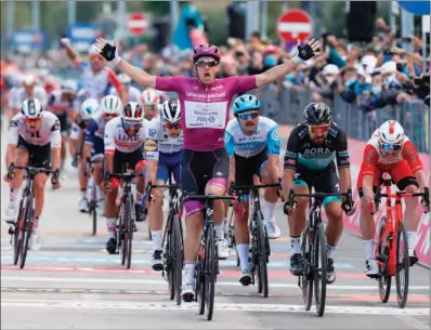  ?? (AFP) ?? Team Groupama-FDJ rider France’s Arnaud Demare, wearing the best sprinter’s mauve jersey, celebrates as he crosses the line and win the 11th stage of the Giro d’Italia 2020 cycling race, a 182-kilometer route between Porto Sant’Elpidio and Rimini on Wednesday.