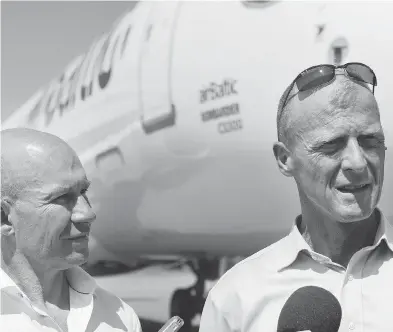  ?? GRAHAM HUGHES / THE CANADIAN PRESS ?? Airbus CEO and president Tom Enders, right, and Bombardier CEO and president Alain Bellemare speak to reporters following an event at Bombardier’s assembly plant in Mirabel, Que. on Wednesday.