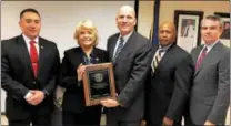  ?? SUBMITTED PHOTO ?? Chester County Sheriff Carolyn “Bunny” Welsh, second from left, holds the commendati­on presented to the Chester County Sheriff’s Office by Chester County District Attorney Tom Hogan, center. She is also joined by, left to right, Chief Deputy Jason...