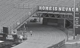  ?? ?? Runners disappear for a few hundred feet each lap at Nevada’s outdoor track at the football field, rendering the track unsuitable for meets.