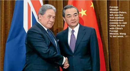  ?? AP ?? Foreign Minister Winston Peters, left, was the first coalition Government minister to visit China. He met with China’s Foreign Minister, Wang Yi, last week.