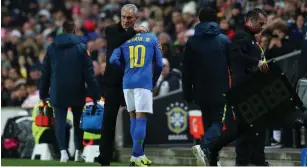  ?? Picture: CATHERINE IVILL/GETTY IMAGES ?? SIDELINE BLUES: An injured Neymar of Brazil is consoled by head coachTite as he leaves the pitch during the internatio­nal friendly against Cameroon at Stadium on Tuesday.