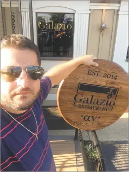  ?? SUBMITTED PHOTO ?? On Sept. 14, Iossif “Joe” Gressis, owner of Galazio Restaurant in La Plata, holds up a plaque he received as a wedding gift. He was told by the town inspector that he had to take it down because it is considered a sign.