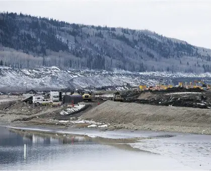  ?? JONATHAN HAYWARD/THE CANADIAN PRESS/FILES ?? Work continues on the B.C. Hydro megaprojec­t to the tune of $60 million a month, even as the NDP government may shut the project down before the end of the year.