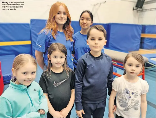  ?? ?? Rising starsHigh-school students Emma Porter and Kyla Pollock with budding young gymnasts