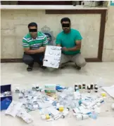  ??  ?? KUWAIT: This photo released by the Interior Ministry yesterday reveals two suspects arrested for practicing medicine illegally.