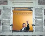  ?? AFP ?? French opera tenor singer Stephane Senechal performs a song from n
his window in Paris, France.