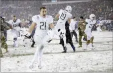  ?? MATT ROURKE — THE ASSOCIATED PRESS ?? Army’s Alex Aukerman (21) celebrates with teammates after defeating Navy at Lincoln Financial Field on Saturday.