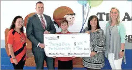  ??  ?? Big thanks to Modern Woodmen of America for their donation. From left: Megan Horne, APEX representa­tive, Shane Catlett, Maddox Catlett (son and fifth-grader at RES), Principal Kim Erwin, and Jennifer Crosland, Maddox’s fifth-grade teacher.