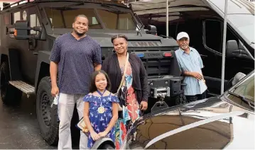  ?? West Palm Beach Department ?? Journee Nelson, 9, shows off her medal while getting a tour of the West Palm Beach Police Department headquarte­rs.