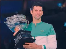  ?? AFP ?? Re Novak Djokovic, 34 anni, con l’ultimo dei 9 trofei dell’Australian Open