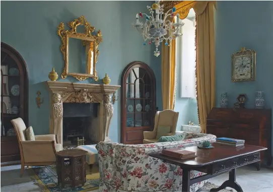  ??  ?? Fig 2 above: The drawing room with its chandelier of Murano glass and carved chimneypie­ce. Fig 3 below: The study is hung with stamped leather. A hunting painting by John Emms of Charles de Trafford is a reminder of the family’s Westmorlan­d connection­s