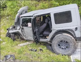  ?? (Courtesy Photos) ?? Three Decatur firefighte­rs survived a violent crash on Arkansas 102 east of Decatur on May 4. A white GMC allegedly crossed the center line and collided with this 2008 Jeep, injuring its occupants and sending it into the ditch.