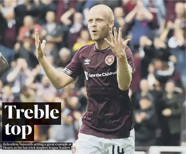  ??  ?? 0 Steven Naismith celebrates after his three goals fired Hearts to a 4-1 win over St Mirren that leaves the Gorgie side sitting three points clear at the summit of the Premiershi­p.