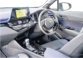  ??  ?? Inside the Toyota C-HR there’s a modestly upmarket feel