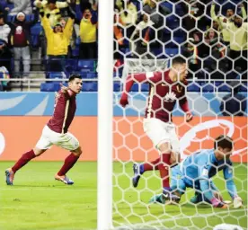  ?? — AFP ?? OSAKA: Club America forward Silvio Romero (2nd L) reacts after scoring a goal during the Club World Cup football match between Jeonbuk Hyundai and Club America in Osaka yesterday.