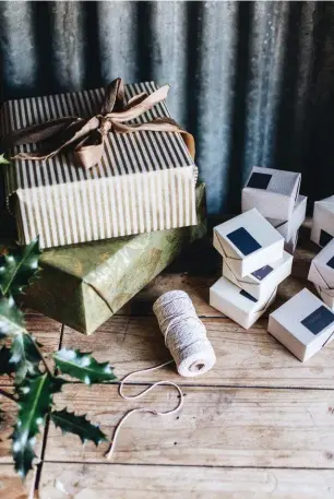  ??  ?? LEFT Aedel soaps ready to be posted out for Christmas. Each boxed soap retails for $10. FACING PAGE Harriet keeps her flock small — she’s holding Rosie’s lamb, who has one blue eye. The other sheep are Malish, Cherry and Rosie.