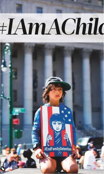  ?? AP ?? A child holds a sign during the rally to protest the Trump administra­tion’s immigratio­n policies in New York.