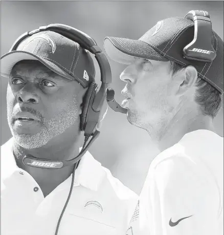  ?? Michael Reaves Getty Images ?? CHARGERS COACH Anthony Lynn, left, says of 34-year-old assistant Shane Steichen: “He’s always had great ideas.”