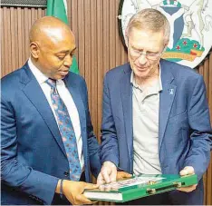  ?? ?? Enugu State Deputy Governor, Barr. Ifeanyi Ossai, receiving the Internatio­nal Fund for Agricultur­al Developmen­t ( IFAD)' s Associate Vice President, Dr. Donal Brown and his team in his office in Enugu.